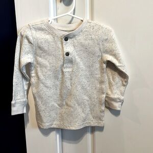 Oatmeal colored thermal buttoned shirt.